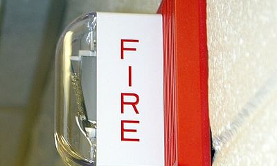 How often should fire alarm systems be inspected in commercial buildings?