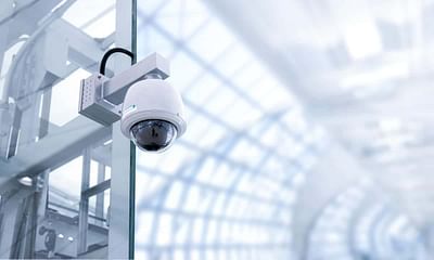 Who owns and has access to surveillance cameras in public places?
